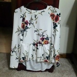 Long sleeve small white with floral print woman's blouse.